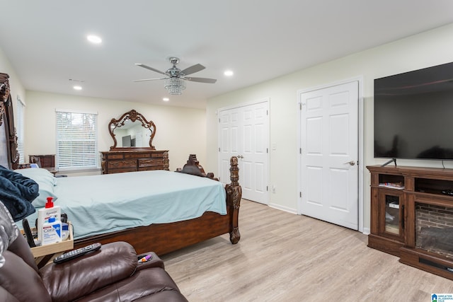 bedroom with ceiling fan and light wood-type flooring