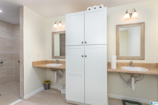 bathroom featuring sink and tiled shower