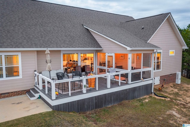 back of house with a wooden deck