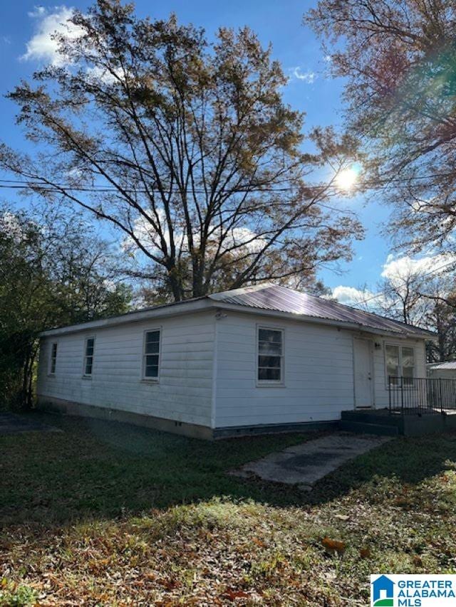 view of home's exterior featuring a wooden deck