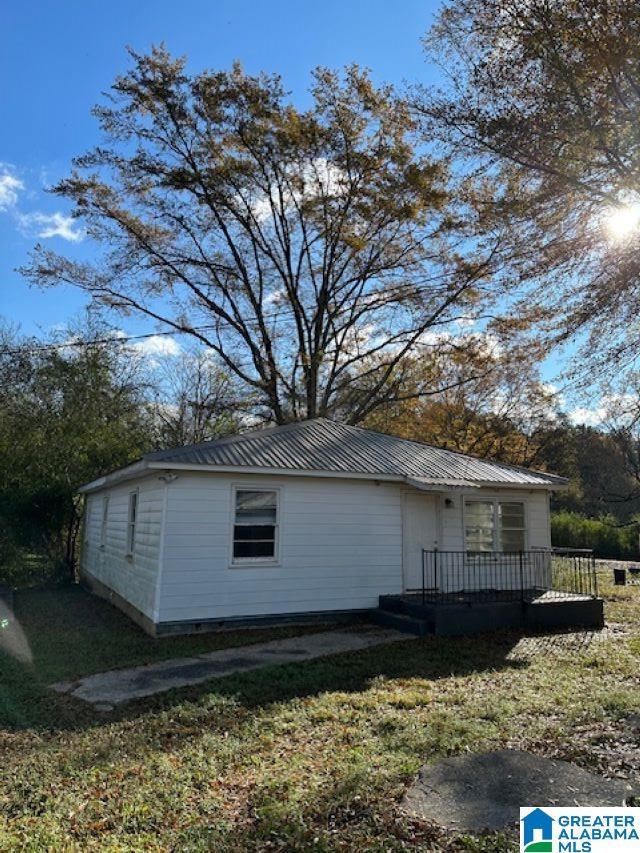 view of property exterior featuring a yard