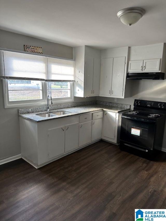 kitchen with dark hardwood / wood-style flooring, white cabinetry, black / electric stove, and sink