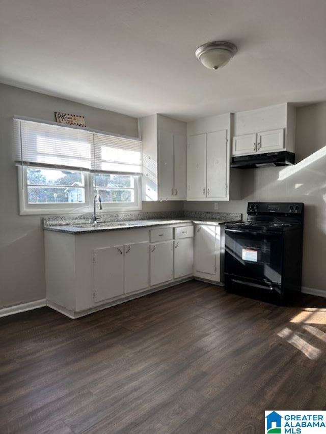 kitchen featuring white cabinetry, dark hardwood / wood-style flooring, and black range with electric stovetop