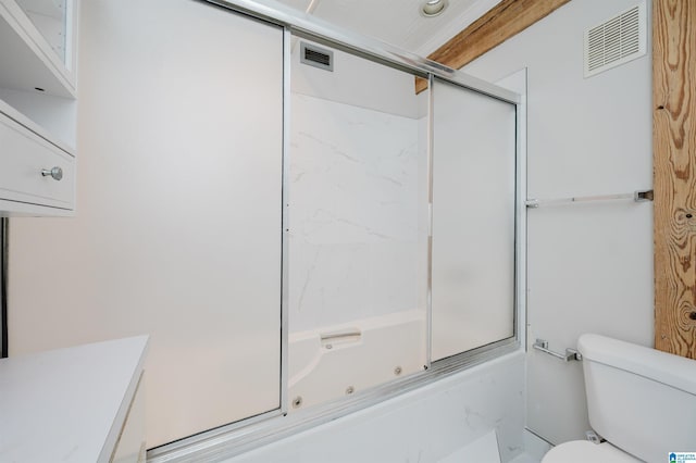 full bathroom featuring shower / bath combination with glass door, vanity, and toilet