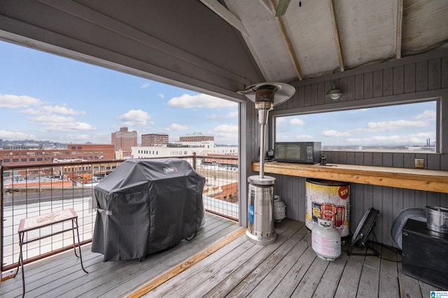 wooden deck with grilling area