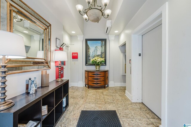 hallway with an inviting chandelier and a wall mounted AC