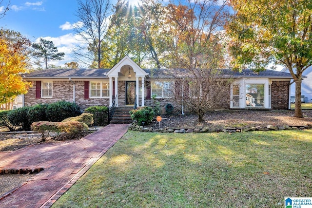 ranch-style house with a front lawn