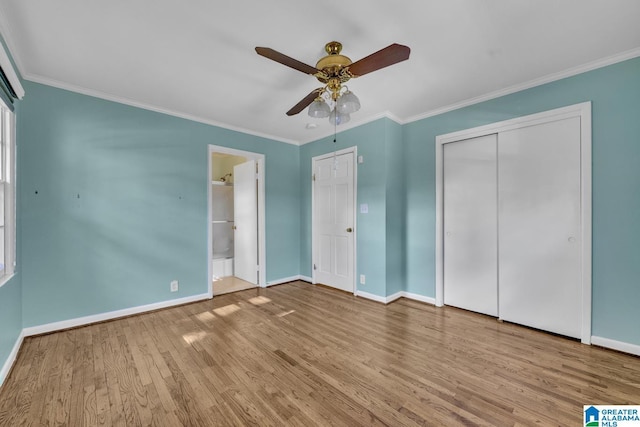 unfurnished bedroom with ensuite bath, ceiling fan, light hardwood / wood-style floors, and ornamental molding