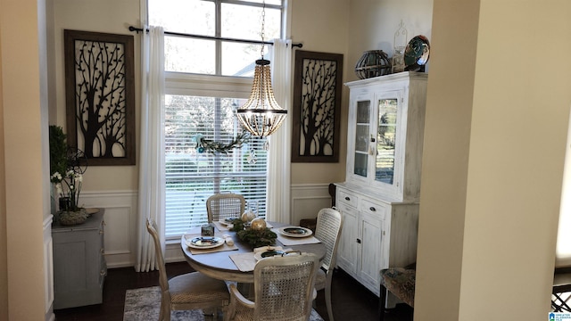 dining space featuring a healthy amount of sunlight and an inviting chandelier