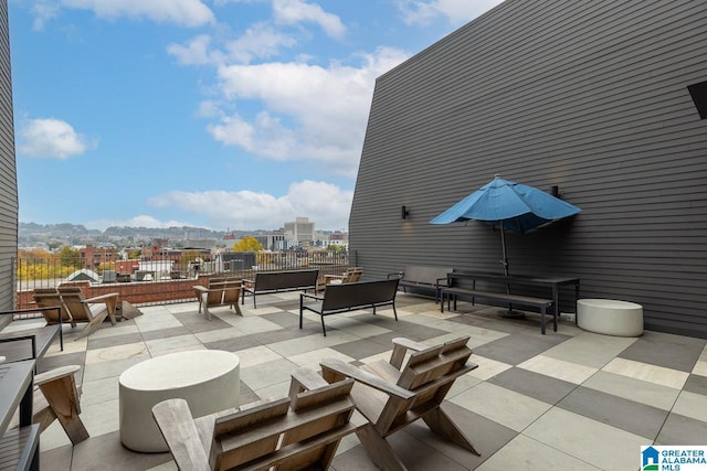 view of patio with an outdoor living space and a mountain view