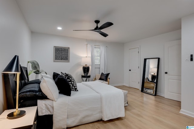 bedroom with light wood-type flooring and ceiling fan