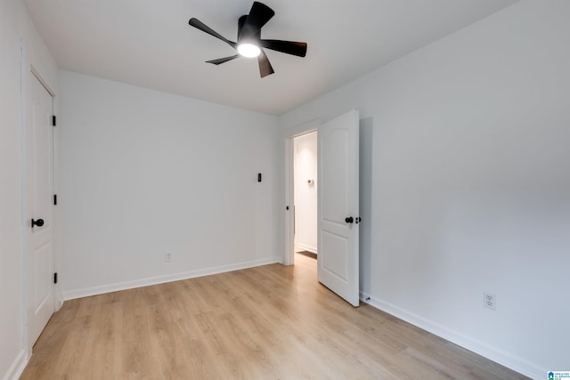 unfurnished bedroom with ceiling fan and light hardwood / wood-style floors