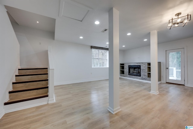 basement with light hardwood / wood-style floors