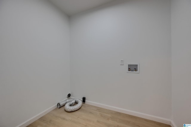 clothes washing area featuring hookup for a washing machine and light hardwood / wood-style flooring