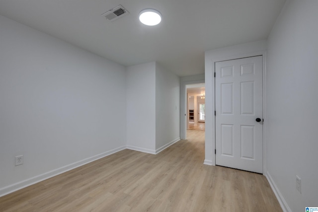 spare room featuring light wood-type flooring