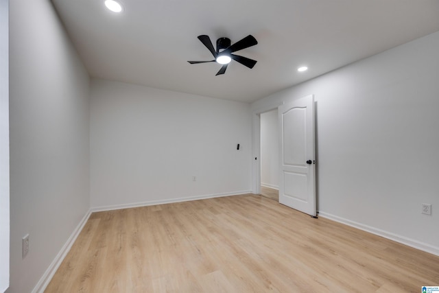 empty room featuring ceiling fan and light wood-type flooring