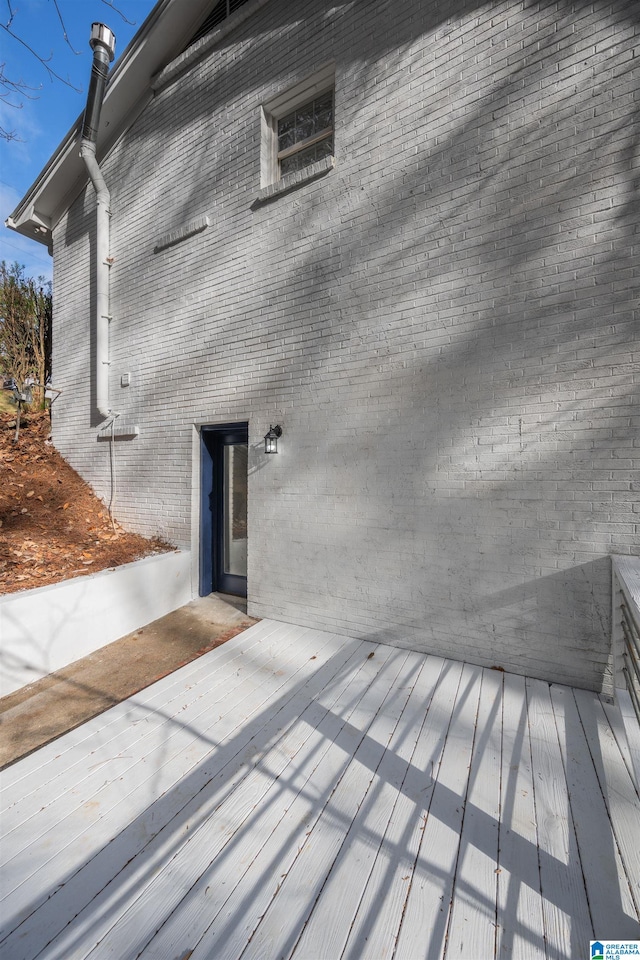 property entrance featuring a wooden deck