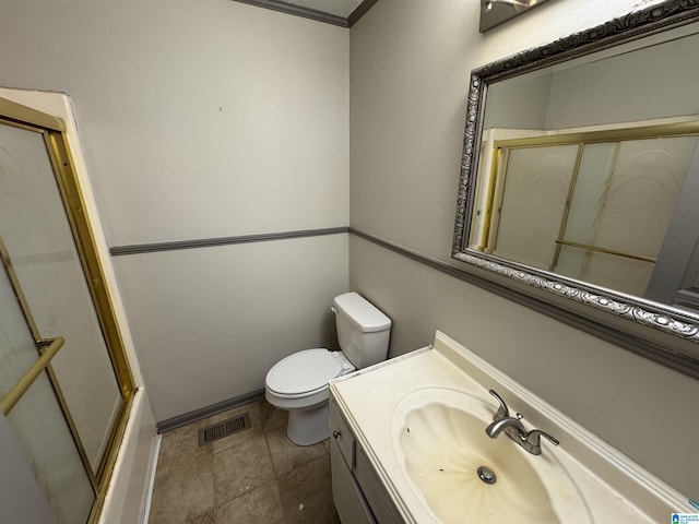 full bathroom with enclosed tub / shower combo, tile patterned floors, toilet, vanity, and ornamental molding