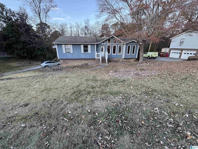 view of front facade with a garage and a front lawn