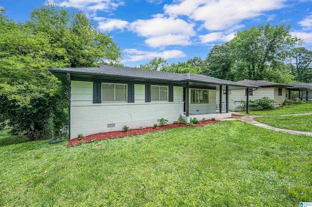 ranch-style house with a porch and a front lawn