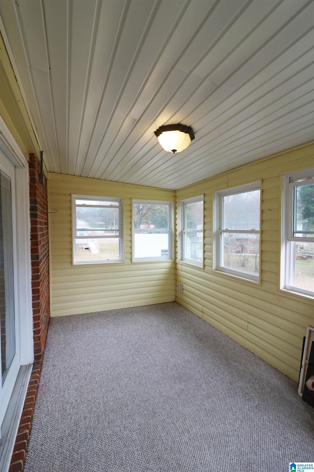 unfurnished sunroom with a healthy amount of sunlight