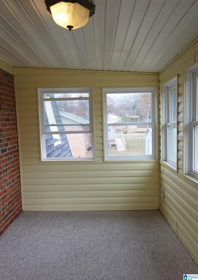 unfurnished sunroom with a healthy amount of sunlight