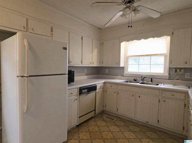 kitchen with dishwasher, backsplash, sink, ceiling fan, and white fridge