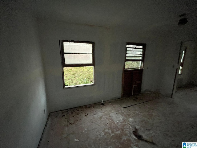 unfurnished room featuring plenty of natural light