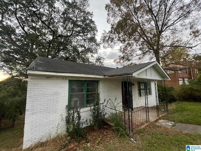 16 Norwood Cir, Birmingham, AL 35234 - view of property exterior featuring brick siding and covered porch
