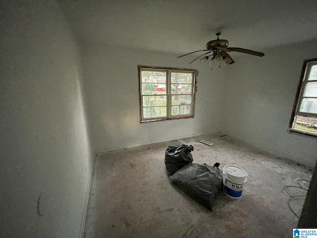 unfurnished room featuring ceiling fan and a textured ceiling