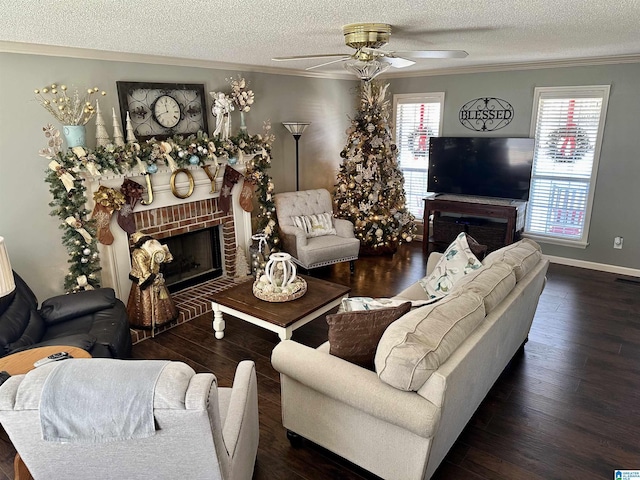 living room featuring plenty of natural light, a brick fireplace, ceiling fan, and ornamental molding