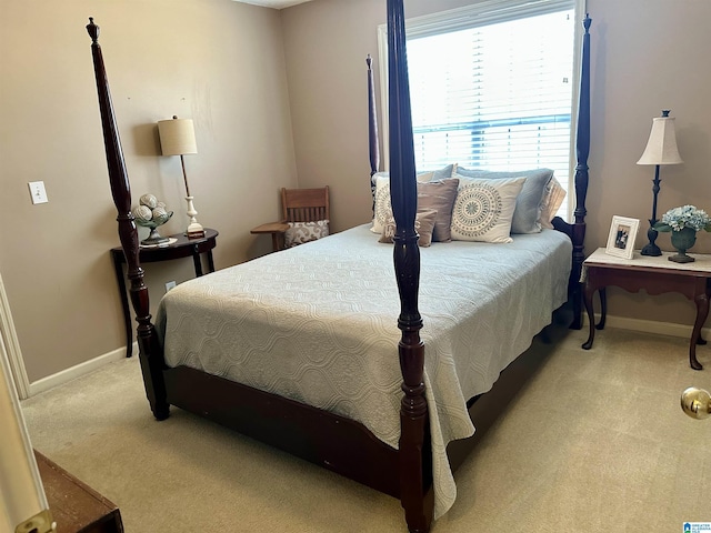 bedroom featuring light carpet