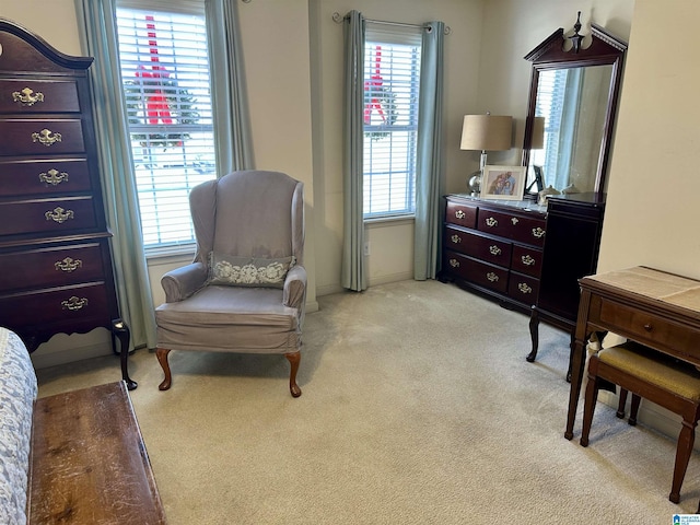 living area with light colored carpet and a wealth of natural light