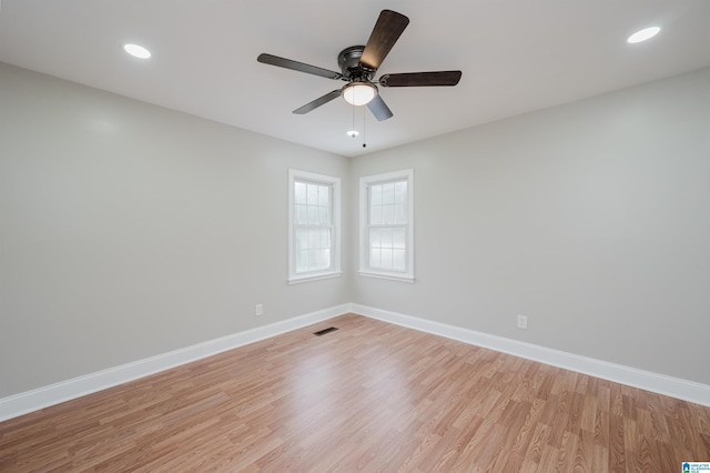 empty room featuring light hardwood / wood-style floors and ceiling fan