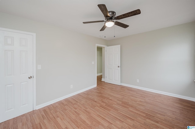 unfurnished room featuring ceiling fan and light wood-type flooring