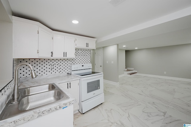 kitchen with white cabinets, white range with electric stovetop, and sink