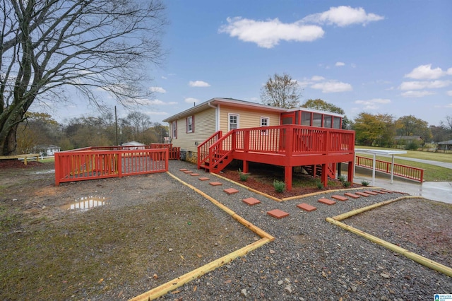 exterior space featuring a deck and a sunroom