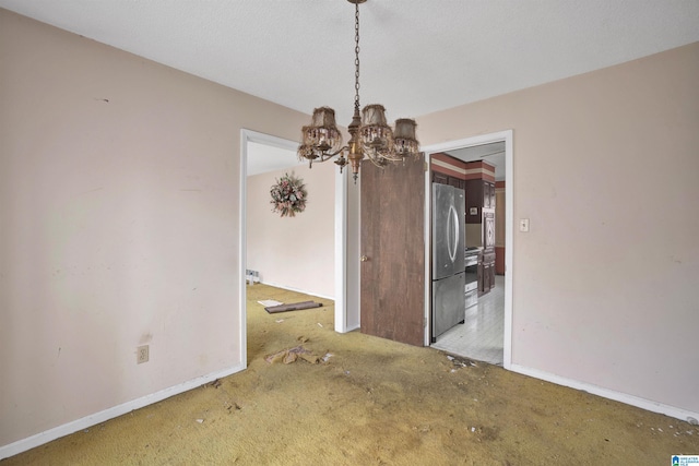 unfurnished dining area with carpet floors and an inviting chandelier