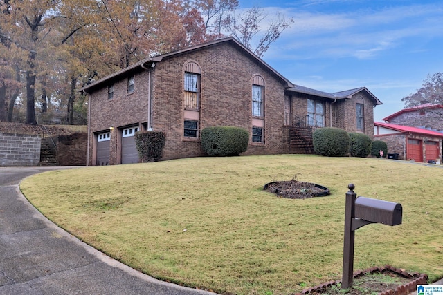 view of side of home with a garage and a lawn