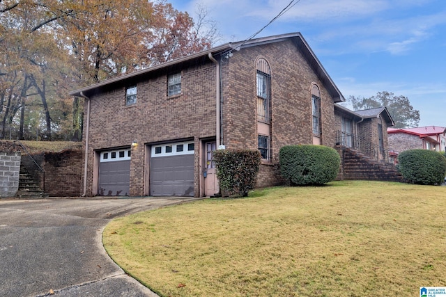 view of side of home with a yard and a garage