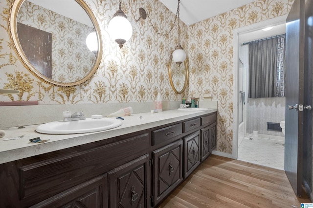 bathroom featuring vanity and hardwood / wood-style flooring