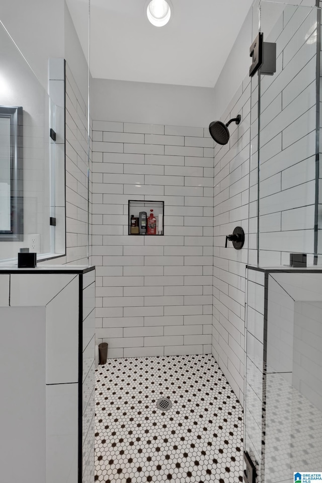 bathroom with a tile shower