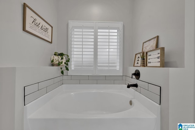 bathroom with a washtub