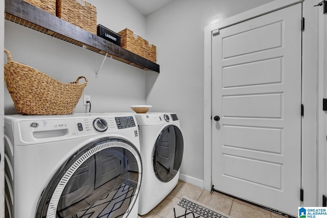 washroom featuring light tile patterned flooring and separate washer and dryer