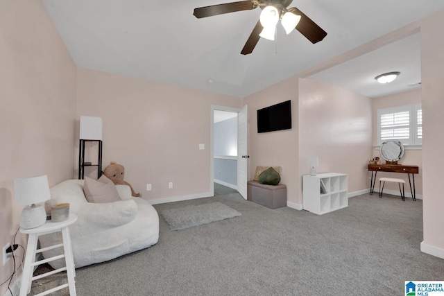 carpeted living room with ceiling fan