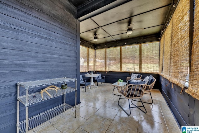 sunroom / solarium with ceiling fan