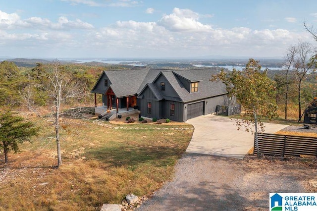 view of front of property with a garage and a front lawn