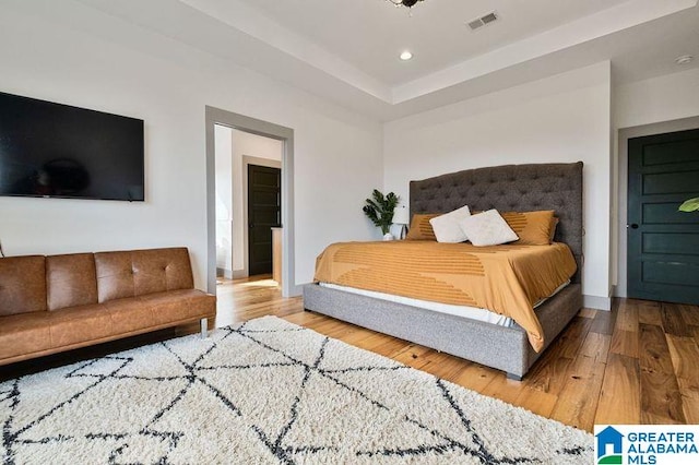 bedroom featuring wood-type flooring