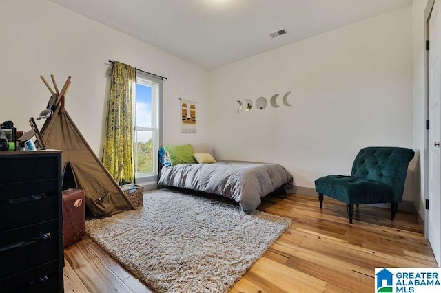 bedroom featuring wood-type flooring