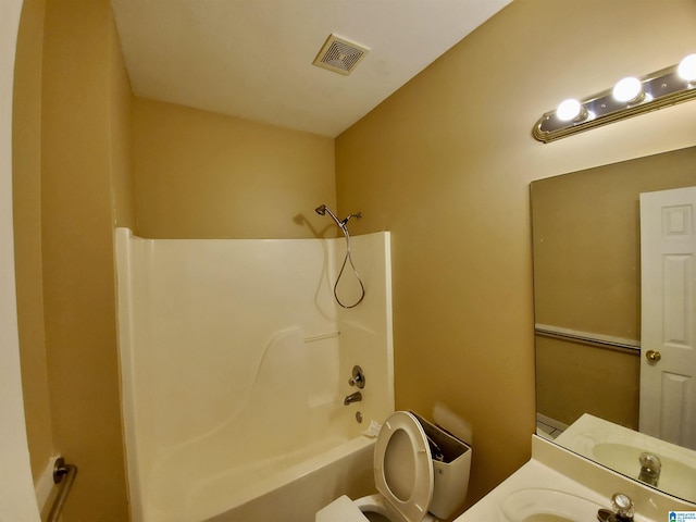 full bathroom featuring vanity, shower / bathtub combination, and toilet